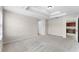 Spacious main bedroom featuring recessed tray ceiling detail and an en-suite bathroom at 3102 Ashland N Ln # 3152, Kissimmee, FL 34741