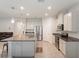 Bright and airy kitchen featuring stainless steel appliances, granite countertops, and a convenient breakfast bar at 3142 Hill Point St, Minneola, FL 34715