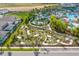 Aerial view of a community with pool, waterpark, and miniature golf course with landscaped grounds at 3624 Lily Ln, Davenport, FL 33897