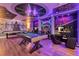 Star Wars-themed basement with a custom mural, pool table, and gaming chairs, plus a custom painted ceiling at 3624 Lily Ln, Davenport, FL 33897