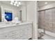 Modern bathroom with double sink vanity, granite countertops, and stylish shower at 3624 Lily Ln, Davenport, FL 33897