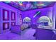 This Star Wars themed bedroom boasts custom paint, themed beds, and unique lighting at 3624 Lily Ln, Davenport, FL 33897