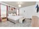 This bedroom features light gray carpet, a padded headboard, and a white duvet cover with white and beige throw pillows at 3624 Lily Ln, Davenport, FL 33897