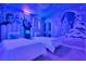 Themed bedroom featuring 'Frozen' themed wall art, twin beds with white linens and decor at 3624 Lily Ln, Davenport, FL 33897
