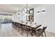 Spacious dining room with seating for fourteen and stylish pendant lighting at 3624 Lily Ln, Davenport, FL 33897