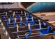 Close up image of a foosball table with blue and grey players; digital scoring on the end at 3624 Lily Ln, Davenport, FL 33897