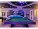 Game room boasting a custom space themed mural, pool table and foosball table at 3624 Lily Ln, Davenport, FL 33897