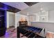 Upstairs game room with bar table, seating, and foosball with a Star Wars theme at 3624 Lily Ln, Davenport, FL 33897