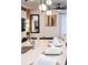 Bright modern kitchen with quartz counters, island seating, and pendant lighting at 3624 Lily Ln, Davenport, FL 33897