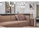 Comfortable living room with neutral colors, stylish decor, and dining room view at 3624 Lily Ln, Davenport, FL 33897