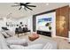 Open concept living area that flows into a bright kitchen at 3624 Lily Ln, Davenport, FL 33897
