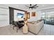 Inviting living room with sleek decor, modern lighting, and sliding door access to backyard at 3624 Lily Ln, Davenport, FL 33897