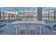 This outdoor patio has a dining table, outdoor seating, and a view of the screened-in pool at 3624 Lily Ln, Davenport, FL 33897