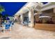 Outdoor restaurant patio with tables, chairs, and signage for Windsor Island Resort at 3624 Lily Ln, Davenport, FL 33897