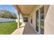 Covered back patio with sliding glass doors and a view of the backyard at 3840 Wood Thrush Dr, Kissimmee, FL 34744