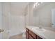 Bathroom with a vanity, mirror, and a shower/tub combo offering practical amenities at 3840 Wood Thrush Dr, Kissimmee, FL 34744
