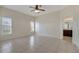 A well-lit bedroom with large windows and ceramic tile flooring at 3840 Wood Thrush Dr, Kissimmee, FL 34744