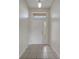 Bright entryway featuring tile flooring, overhead lighting, and decorative sidelight window at 3840 Wood Thrush Dr, Kissimmee, FL 34744