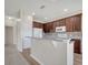 Kitchen featuring granite countertops, dark wood cabinets and stainless steel appliances at 3840 Wood Thrush Dr, Kissimmee, FL 34744