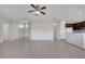 An expansive living area features ceramic tile floors and neutral paint at 3840 Wood Thrush Dr, Kissimmee, FL 34744