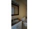 A well-lit bathroom features a white vanity, sleek lighting fixture, and a clean, functional design at 404 Banyon Tree Cir # 202, Maitland, FL 32751