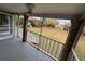 The outdoor patio features brick railings with screening, views of lawn, and mature trees at 404 Banyon Tree Cir # 202, Maitland, FL 32751