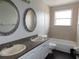Bathroom featuring dual sinks and bathtub at 409 Lytton Cir, Orlando, FL 32824