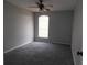 Neutral bedroom with window, fan, and carpeted floor at 409 Lytton Cir, Orlando, FL 32824
