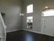Bright foyer with staircase and modern lighting at 409 Lytton Cir, Orlando, FL 32824