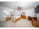 Spacious bedroom featuring one bed, and wood furniture at 466 Peppermill Cir, Kissimmee, FL 34758