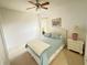 Bedroom features a bed, carpet flooring, and a ceiling fan at 466 Peppermill Cir, Kissimmee, FL 34758