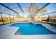 Backyard pool with spa and screened enclosure, perfect for outdoor entertaining and relaxation at 466 Peppermill Cir, Kissimmee, FL 34758