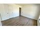 Comfortable bedroom features new flooring and a spacious closet for ample storage at 4861 Haines Circle, Orlando, FL 32822