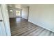 Living room showcasing gray wood flooring and a bright and airy feel with neutral colors at 4861 Haines Circle, Orlando, FL 32822