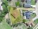 Aerial view showing the property outlined with trees and lawn at 509 Lakeview Dr, Kissimmee, FL 34759