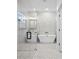 Modern bathroom featuring a freestanding tub, glass-enclosed shower, and stylish tile work at 509 Lakeview Dr, Poinciana, FL 34759