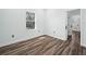 Small bedroom with light walls and wood flooring at 509 Lakeview Dr, Poinciana, FL 34759