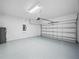 Clean and organized two-car garage with epoxy flooring at 509 Lakeview Dr, Kissimmee, FL 34759