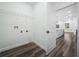 View from laundry room leading to the kitchen, showcasing the modern open floor plan at 509 Lakeview Dr, Poinciana, FL 34759