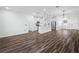 Spacious open floorplan with laminate flooring connecting the kitchen, dining, and living areas at 509 Lakeview Dr, Poinciana, FL 34759