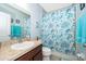 Bathroom featuring a shower with ocean themed curtain and a single sink vanity at 579 Lucerne Blvd, Winter Haven, FL 33881