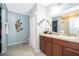 Bathroom featuring decorative wall art and a vanity with dark wood cabinets at 579 Lucerne Blvd, Winter Haven, FL 33881