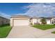 Well-kept lawn and garden highlight the home's exterior, along with an attached two car garage at 579 Lucerne Blvd, Winter Haven, FL 33881