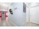 Hallway features tile flooring, neutral paint, and updated trim leading to the living area at 579 Lucerne Blvd, Winter Haven, FL 33881