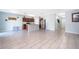 Spacious open-concept kitchen and living room area features tile floors and natural lighting at 579 Lucerne Blvd, Winter Haven, FL 33881