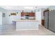 Open kitchen with center island, stainless steel appliances, and tile floors provides lots of space at 579 Lucerne Blvd, Winter Haven, FL 33881