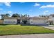 Charming one-story home with a well-manicured lawn and a two car garage at 8452 Sandberry Blvd, Orlando, FL 32819
