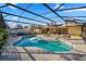 Enjoy a backyard oasis with a sparkling pool and a spacious screened enclosure at 8452 Sandberry Blvd, Orlando, FL 32819