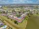 Scenic aerial view showing the community's layout, pool, and pond at 86 Pine Island Cir, Kissimmee, FL 34743