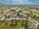 Community aerial view showcasing the pool, landscaping, and neighborhood at 86 Pine Island Cir, Kissimmee, FL 34743